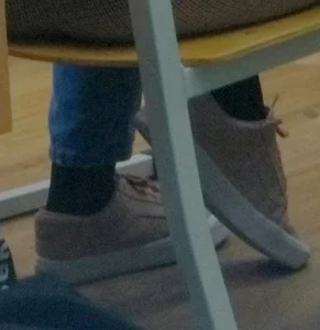 College Teen's Feet in Pink Sneakers