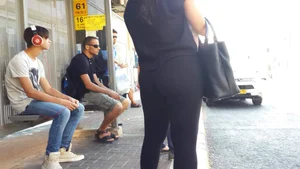 Sexy ass in leggings waiting for the bus