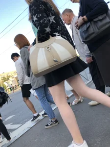 Candid girl wearing a short skirt crossing the street, awesome pale legs