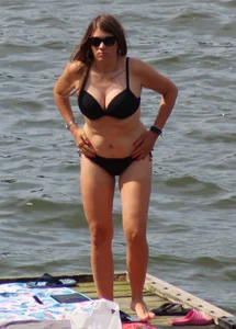 Thick babe with big boobs in a black bikini