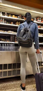 Beautiful brunette shopping in tight grey spandex with a great ass