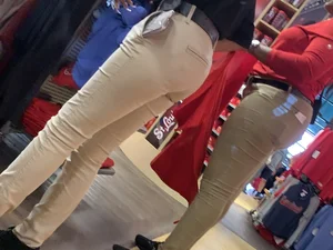 Bunch of girls in various outfits at a Cardinals baseball game