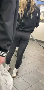 Tight ass sports team in line at airport