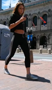 Redhead in black spandex in the sun