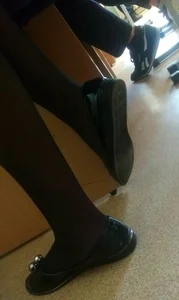 College Teen's Feet in Black Pantyhose and Shoes Closeup Creepshot in a Classroom