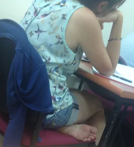 Cute Candid Barefoot Girl in Denim Shorts Sitting at a Desk Creepshot