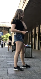 Cute Girl Distributing Leaflets in Shorts City Candid Gallery