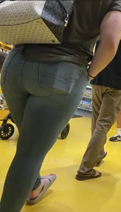 Thick brunette filling out jeans at Lego Store