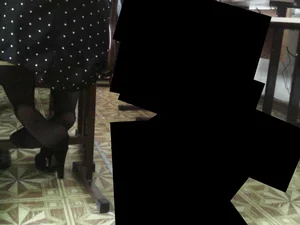 College Girl in a Black Polka-Dot Dress And Black Pantyhose Sitting at a Desk in Classroom With One Shoe Taken Off