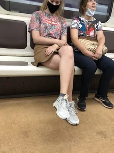 Amazing Hot Girl in a Skirt and Sneakers Sitting Cross-Legged in the Subway Train and on the Escalator Candid Photos Gallery