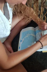 Cure Barefoot Girl With Curly Hair Sitting With Crossed Legs Downblouse Creepshot