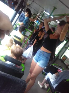 Amazingly Hot Girl in a Top and Denim Shorts Standing in a Public Bus - Sexy Legs