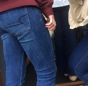 2 nice asses in tight jeans standing around