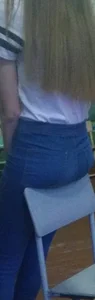Cute Girl Leaning on Chair - Booty in College Classroom Closeup Photo