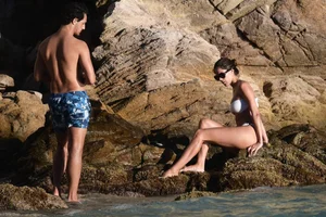 Iris Mittenaere in a white thong bikini on the beach in St Martin