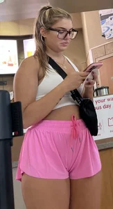 Bespectacled blonde chick in shorts