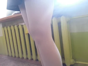 Candid college teen's legs in white pantyhose closeup