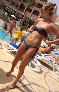 Sexy blonde babe in a bikini at the pool