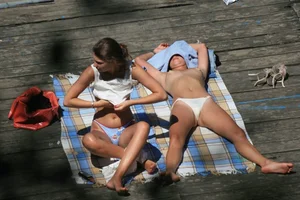 Two teens stripping and going topless to tan