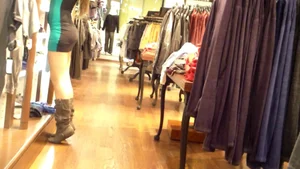 Hot shop assistant in leggings on her tiptoes