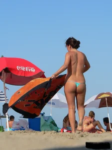 2 topless thonged sexy friends on the beach with great bodies
