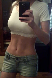 Girl in a Top and Denim Shorts Home Mirror Selfie - Big Boobs and Flat Muscular Tummy