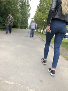 Young Blonde Girl in Tight Blue Jeans Scratching Her Booty While Passing By on the Suburban Street Creepshots Gallery