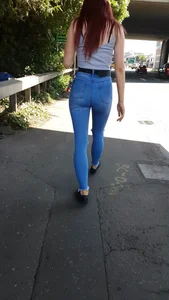 Redhead with a nice ass in tight jeans walking