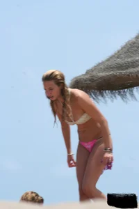 Hot beach girl undressing and going topless