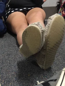 Girl in a Dress Sitting on the Floor With Crossed Legs