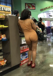Latina with hard nipples and a big booty in tight spandex shorts outfit