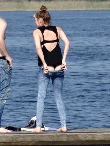 Girl on the water in black thong bikini with a nice ass