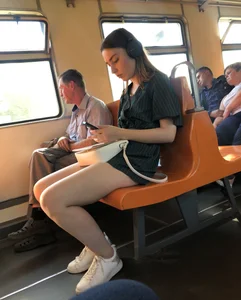 Amazing Hot Girl Sitting in the Train in Shorts Showing Off Her Gorgeous Legs Candid Gallery