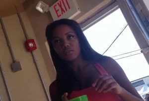 Sexy black girl in short white shorts