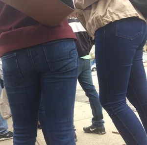 2 nice asses in tight jeans standing around