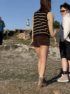 Hot Asian chick wearing mini shorts with her butt cheeks visible