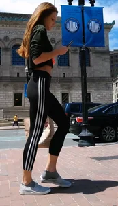 Redhead in black spandex in the sun