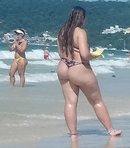 Fat ass milf at the beach in a thong bikini