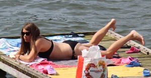 Thick babe with big boobs in a black bikini