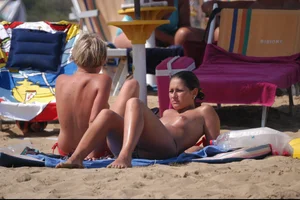 Girls on a nude beach in Bibione, Italy