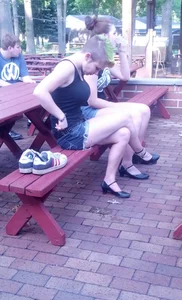 Candid Girl in Denim Shorts Sitting With Crossed Legs on the Bench Street Creepshot