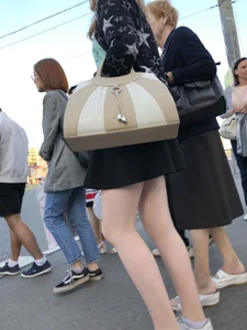 Candid girl wearing a short skirt crossing the street, awesome pale legs
