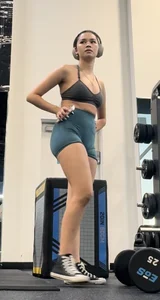 College Asian girl working out in tight blue shorts