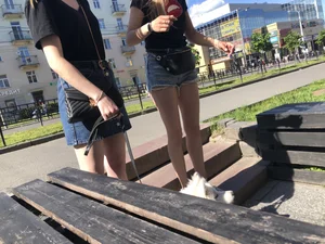 Girl in Denim Shorts with Amazing Hot Legs Fixing Her Sandals Street Candid Photo Gallery