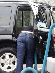 Girls cleaning their cars in jeans and pants