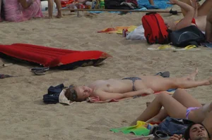 Topless girls on a beach in Barcelona