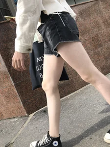 Cute candid teen with pale slim legs in shorts