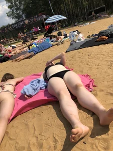Hot Girls in Swimsuits Lying on a Beach Gallery