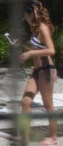Sexy Asian girl with tattoos in a thong bikini