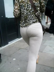 Brunette lady with a nice ass in light grey leggings walking